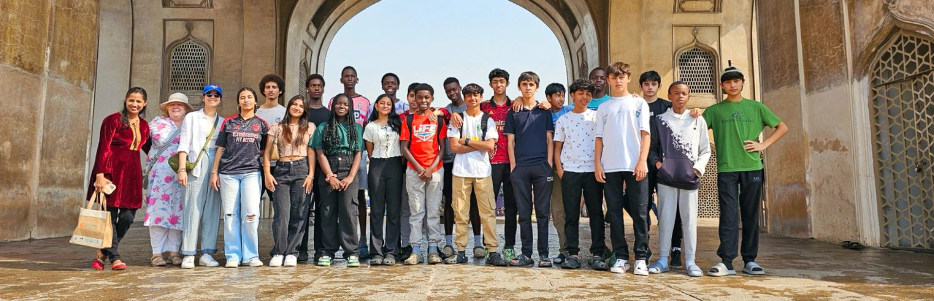 Students standing outside at a fort.